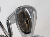 a close up of a set of golf irons on a table