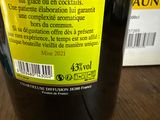a bottle of wine sitting on a table with a label on it