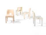 four chairs that are arranged in a circle