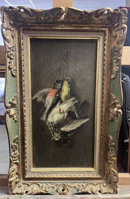 une photo d'un tableau représentant des oiseaux, dans un cadre