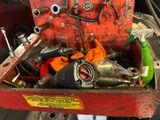 a red tool box with tools inside of it
