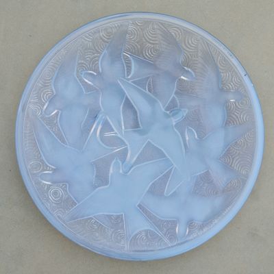 a glass plate with a design on it on a table