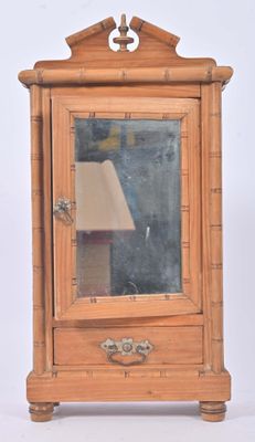 a small wooden cabinet with a mirror on top of it