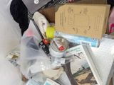 a box full of items that are sitting on a bed