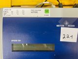 an image of a meter on a wooden table with wires