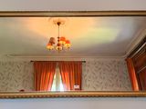 a mirror hanging on the wall in a room