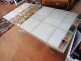 a table that has a tile top on it