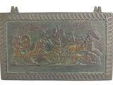 a metal plaque with a picture of a horse drawn carriage
