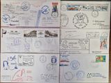 several different stamps and stamps are on a table with a pen