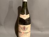 a bottle of wine that is sitting on a table