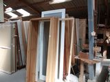 several pieces of wood are stacked up in a warehouse