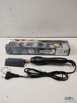 a close up of a hair brush and comb on a table