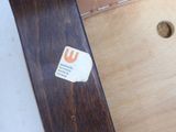 a snowboard with a sticker on it sitting on a table