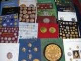 a lot of books on a table with a blue table cloth