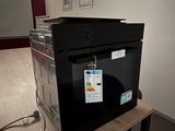 a microwave that is sitting on a table in a room