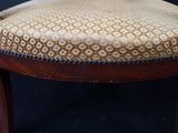 an image of a wooden chair with a patterned upholstered seat
