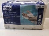 two rolls of toilet paper sitting on top of a white counter