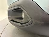a close up of a car ' s bumper with a small hole in it