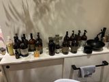 many bottles on the shelf in the bathroom