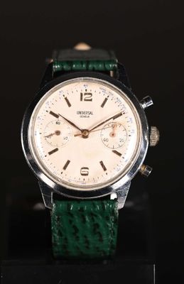 an image of a close up of a wrist watch on a black surface