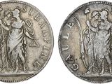 une pièce d'argent portant l'image d'une femme et d'un homme