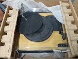 a box with a record and a hat inside of it