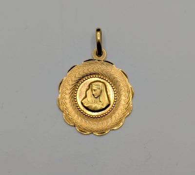 a close up of a gold coin with a woman ' s face on it