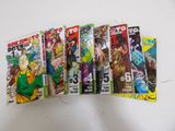 six comics are lined up in a row on a table