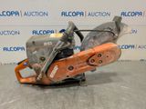 a close up of a chainsaw sitting on top of a table