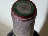 a bottle of wine that is sitting on a table