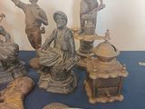 a lot of statues that are on a blue table