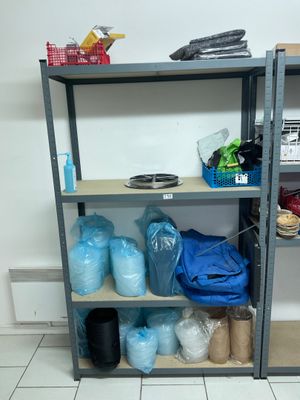 a shelf with many items on it in a room