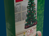 a lego christmas tree in a box on a blue background