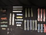 a lot of toy trains that are on the table