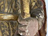 a statue of a man holding a knife in his hand
