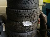 tires stacked on top of each other in a garage