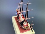 a model of a ship in a box on a table