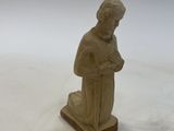 figurine of a woman holding a baby in her arms