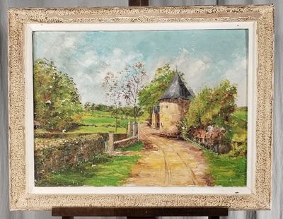 a painting of a house on a easel in a room