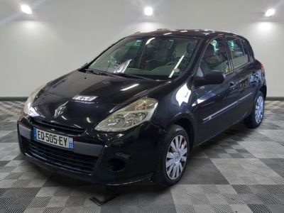 a picture of a small black car parked in a garage