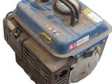 a blue and black portable generator on a white background
