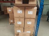 many boxes stacked on top of each other in a warehouse