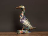 a bird that is sitting on top of a wooden table