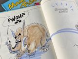 a cartoon book with a picture of a cat and a mouse