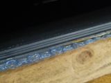 a close up of a piece of wood with a piece of glass on it