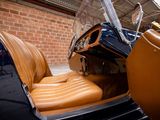 a brown leather seat in the back of an old car