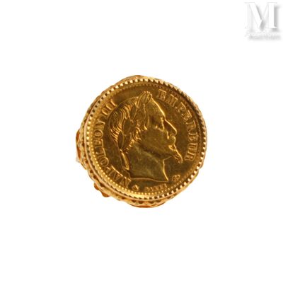 l'image d'une pièce d'or sur laquelle figure le visage d'un homme