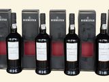 six bouteilles de vin rouge sont alignées