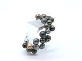 bracelet with black pearls and silver beads on a white background
