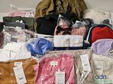 a pile of clothing that is sitting on the floor